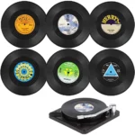 Set of vinyl record coasters on a wooden table