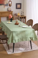 French country tablecloth with retro plaid pattern and lotus leaf edge on a dining table