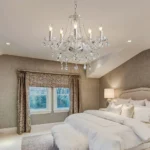Elegant crystal chandelier illuminating a modern living room with sparkling light