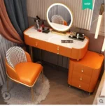 Modern dressing table with mirror and stool in a minimalist bedroom setup
