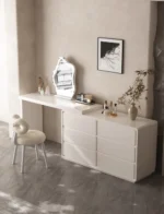 Modern LED vanity desk with mirror and stool in bedroom setting