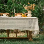 Retro polka dot tablecloth with fringe on a wooden table