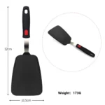 Goldoma high heat resistant spatula in use on a non-stick frying pan
