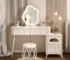 Modern wood makeup vanity with stool, featuring a mirror and drawer in a bright bedroom