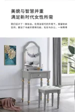 Modern white dressing table with mirror and stool in a bedroom setting