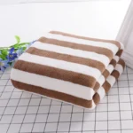 Hotel beauty salon quick-drying beach towel home soft absorbent face towel striped coral fleece bath towel – in a cozy room