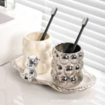 Electroplated ceramic mug set in a gift box, showing the two cups with gold finish.