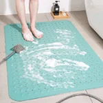 Non slip bath mat with suction cups in a white bathroom
