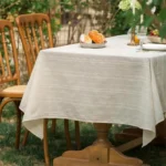 Retro polka dot tablecloth with fringe on a wooden table