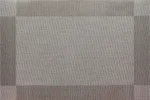 Gold weave placemats on a dining table with plates and cutlery