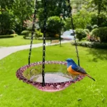 Hanging water bowl for birds, featuring a blue glazed ceramic basin and sturdy metal chain.