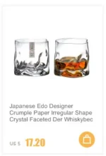 Set of hazy wine glasses with hammer pattern and snowflake design on a wooden table