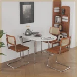 Nordic minimalist folding dining table with stainless steel telescopic extension in a modern living room setting