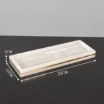 Marble toothbrush holder with two slots, top view.