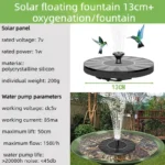 Outdoor bird bath fountain with solar panel and water spray in a garden