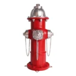 Close-up of resin fire hydrant statue, textured surface and metal-like paint.