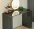 Modern vanity desk with mirror and drawers in a bright bedroom setting