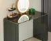 Modern vanity desk with mirror and drawers in a bright bedroom setting