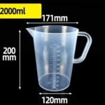 Transparent plastic lab beaker with measurement scale on kitchen counter