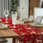 Christmas table runner with elk pattern on a dining table