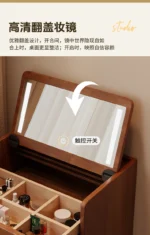 Wooden makeup vanity with mirror and stool in a modern bedroom setting