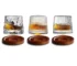 Rotating whiskey glass with wooden base on a bar table