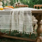Retro polka dot tablecloth with fringe on a wooden table