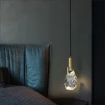 Modern crystal pendant lamp illuminating a dining room with elegant light refraction