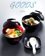 Japanese style ramen bowl set with melamine bowls, spoons, and noodle cups on a table