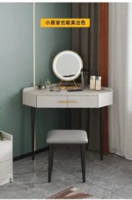 Goldoma modern corner dressing table with mirror and stool in a bedroom