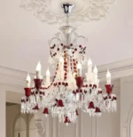Modern red crystal chandelier with clear red K9 crystals hanging in a living room