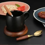 4-piece stainless steel flatware set with sapele wooden handles on a table