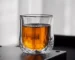 Double wall glass cups with amber liquid, showing insulation and clarity