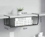 Metal under shelf basket hanging from a kitchen shelf, holding spices and small jars