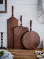 Elegant walnut cutting board with French vintage design, perfect for bread, cheese, and fruit presentation