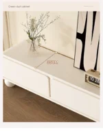 Nordic wood TV stand with drawers in a modern living room corner, featuring clean lines and ample storage