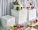 Set of 8 clear acrylic display risers for desserts, cosmetics, and gifts