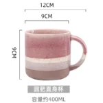 Large ceramic coffee mug with retro design and handle on wooden table