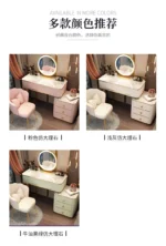 French white wooden dressing table with mirror and stool in a modern bedroom setting