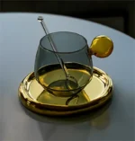 Nordic coffee cup set with saucer and spoon on a wooden table