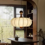 Walnut wood chandelier with fabric shades in a cozy living room