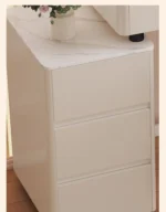 Modern vanity table with mirror and storage drawers in a bedroom setting