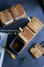 Ceramic kitchen storage container set with matte striped design and spoon