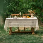 Retro polka dot tablecloth with fringe on a wooden table