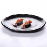 Black melamine dinner plates stacked elegantly on a wooden table