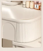 Modern wood makeup vanity table with mirror, drawer, and stool in a bedroom setting