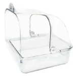 Bird bath tub attached to a window, showing outdoor scenery through glass.