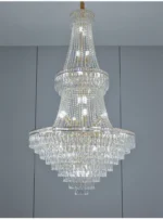 Modern crystal chandelier for dining room hanging over a wooden table with warm glow