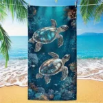Sea turtle beach towel with vibrant underwater pattern on a sandy beach
