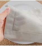 White linen cloth napkins hemstitched cocktail napkins set of 100 on wooden table